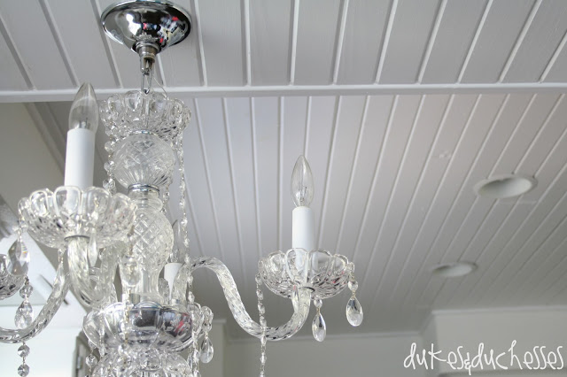 chandelier on planked ceiling