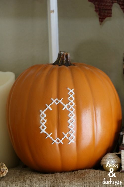 monogrammed pumpkin on thanksgiving mantel