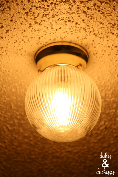 old light fixture in laundry room