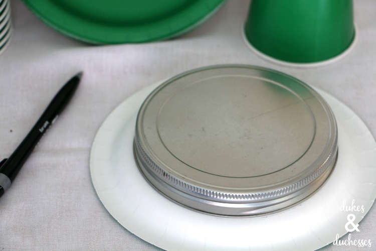 traced circle on paper plates for leprechaun hat treat cups