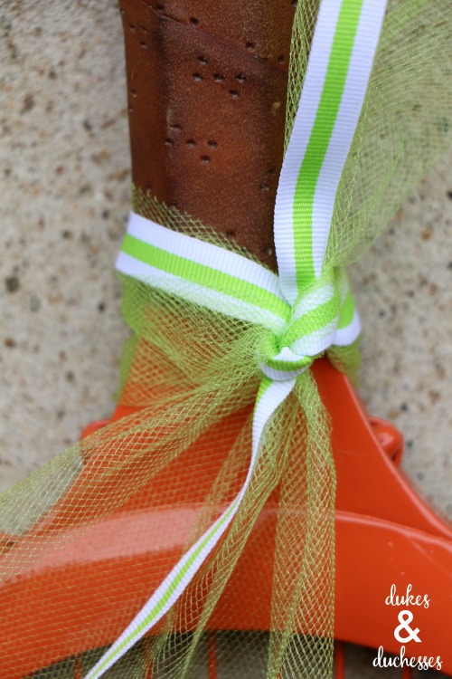 ribbon trim on repurposed tennis racquet pumpkin