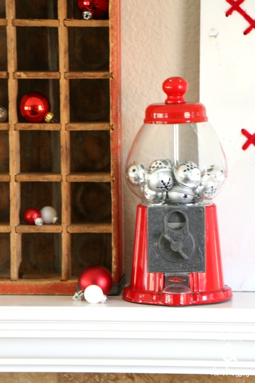 bubblegum machine with silver bells on christmas mantel