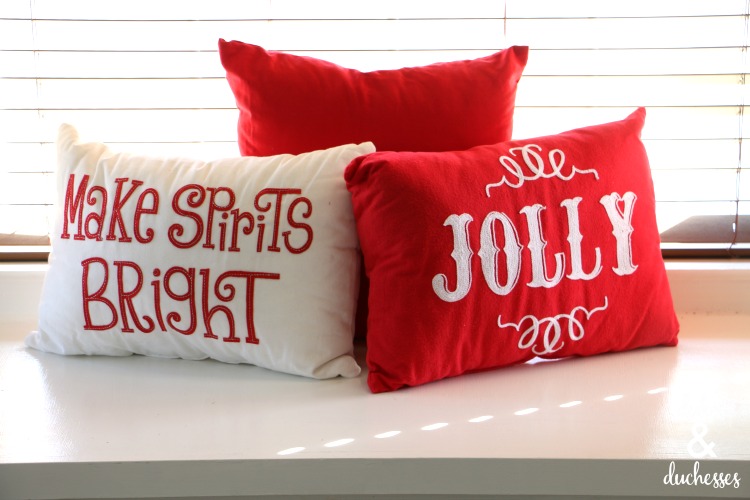 christmas pillows on window seat in kitchen