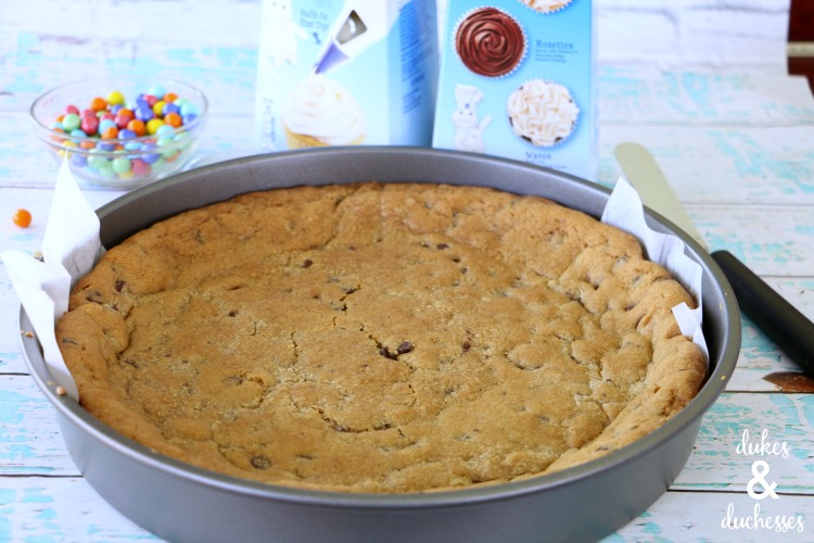 baked cookie cake with parchment paper lifter